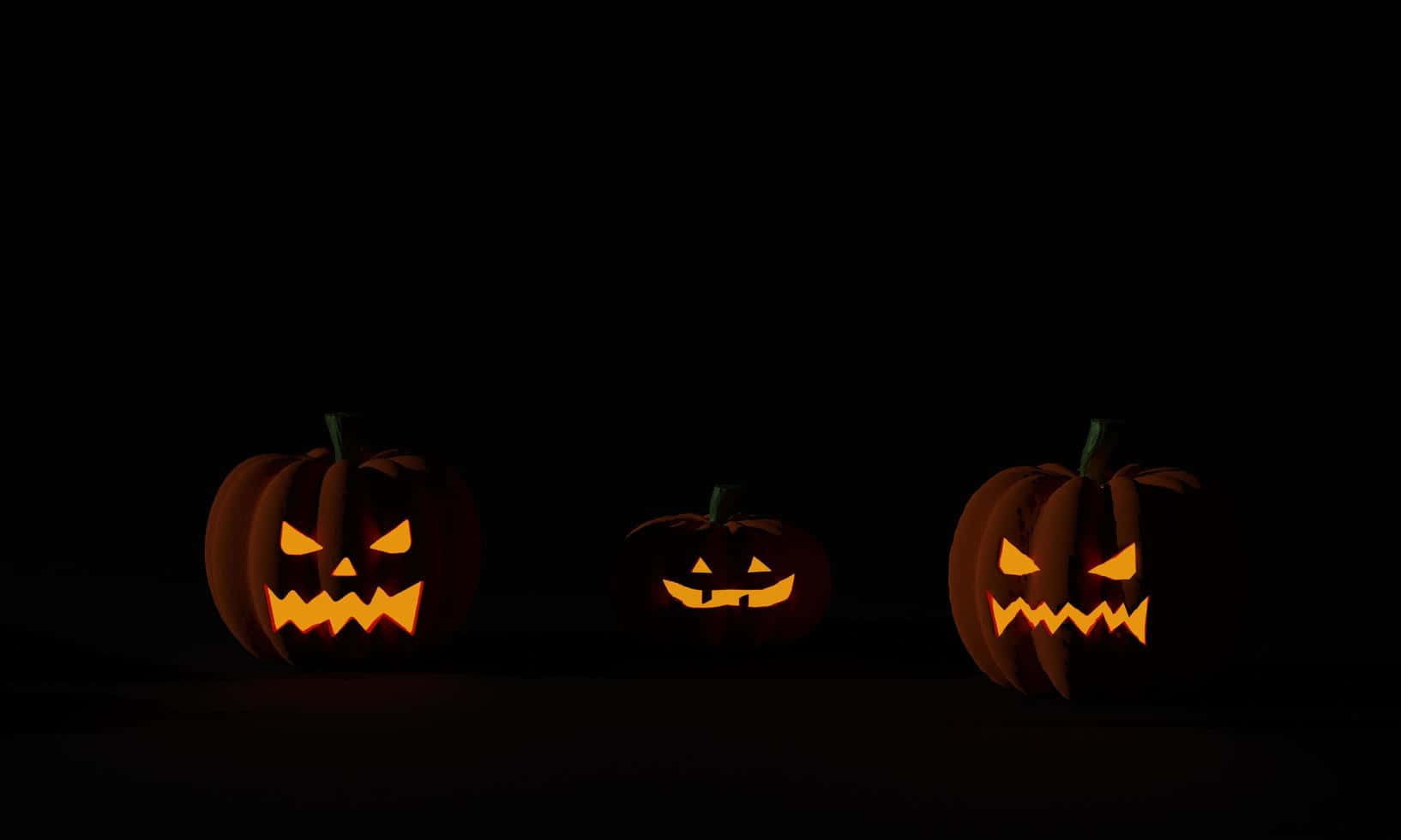 ハロウィンのカボチャ3つ ダークな背景 壁紙