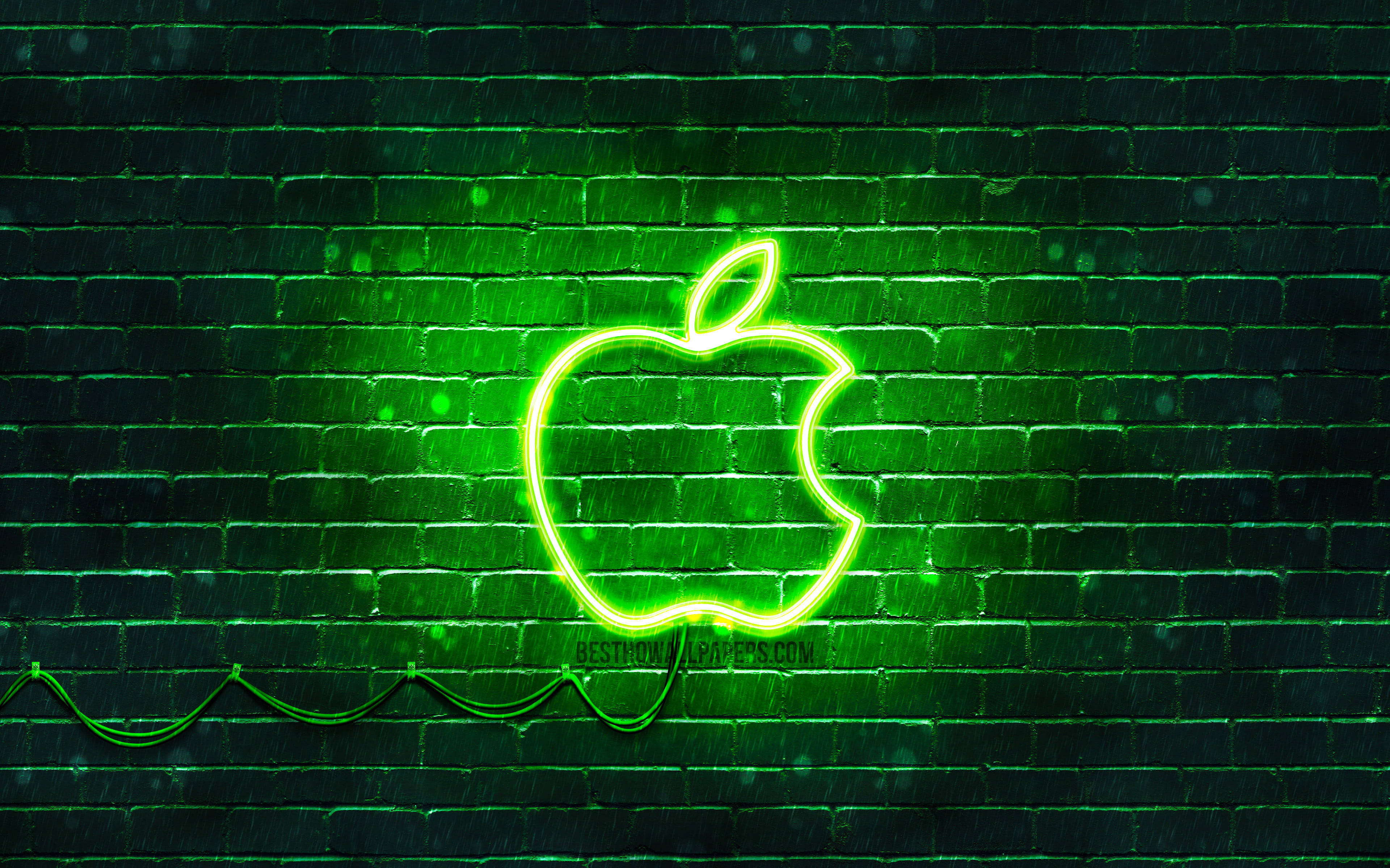 レンガ壁に浮かぶネオングリーンのAppleロゴ 壁紙