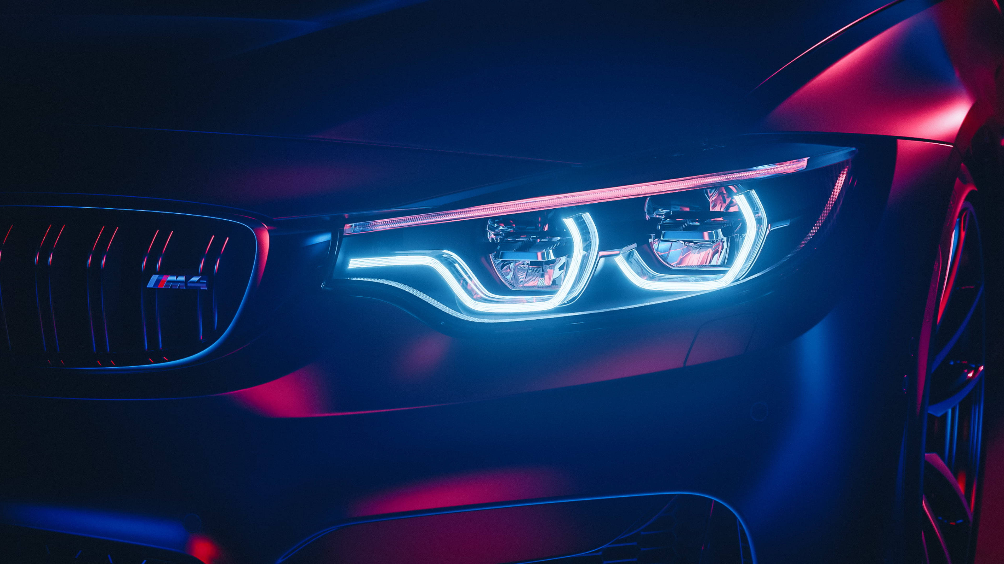 BMW M4 明るいヘッドライトのクローズアップ 壁紙