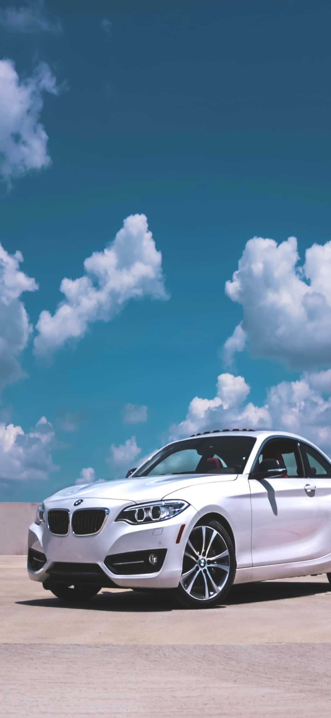 革新的なデザインとテクノロジー：iPhone XとBMW 壁紙