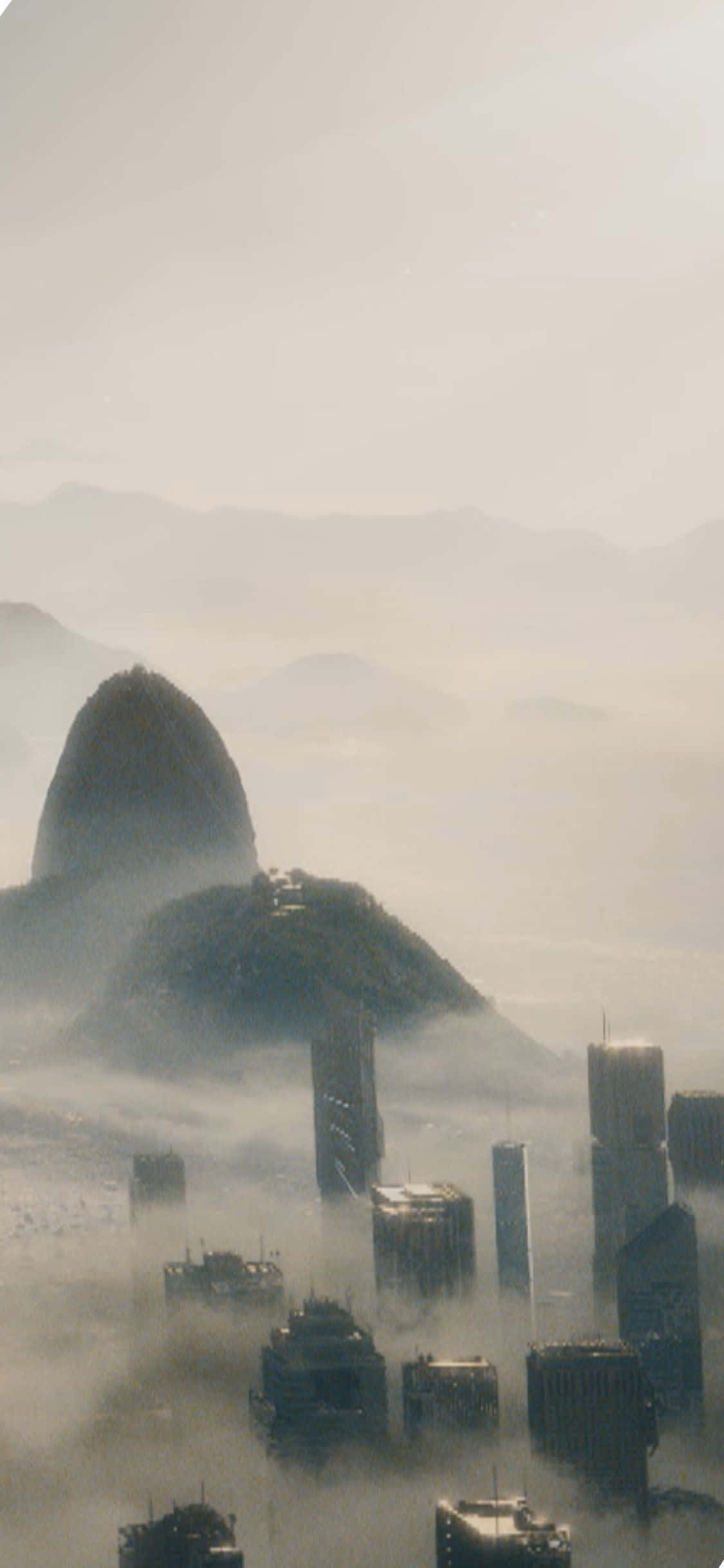 iPhone XS Civilization Beyond Earth かすむ建物と山々の背景 壁紙