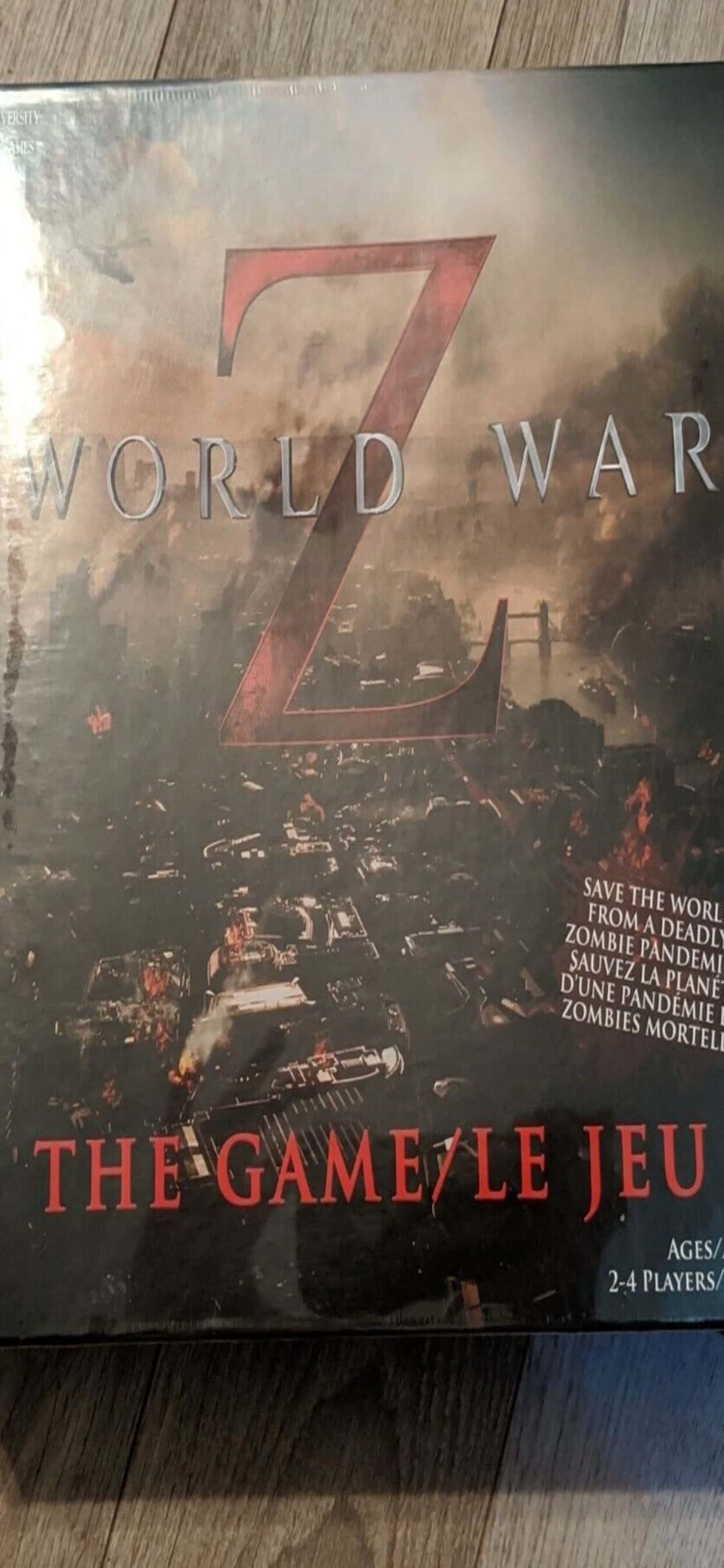 World War Zの暗いイメージが映るiPhone XS Maxの画面 壁紙