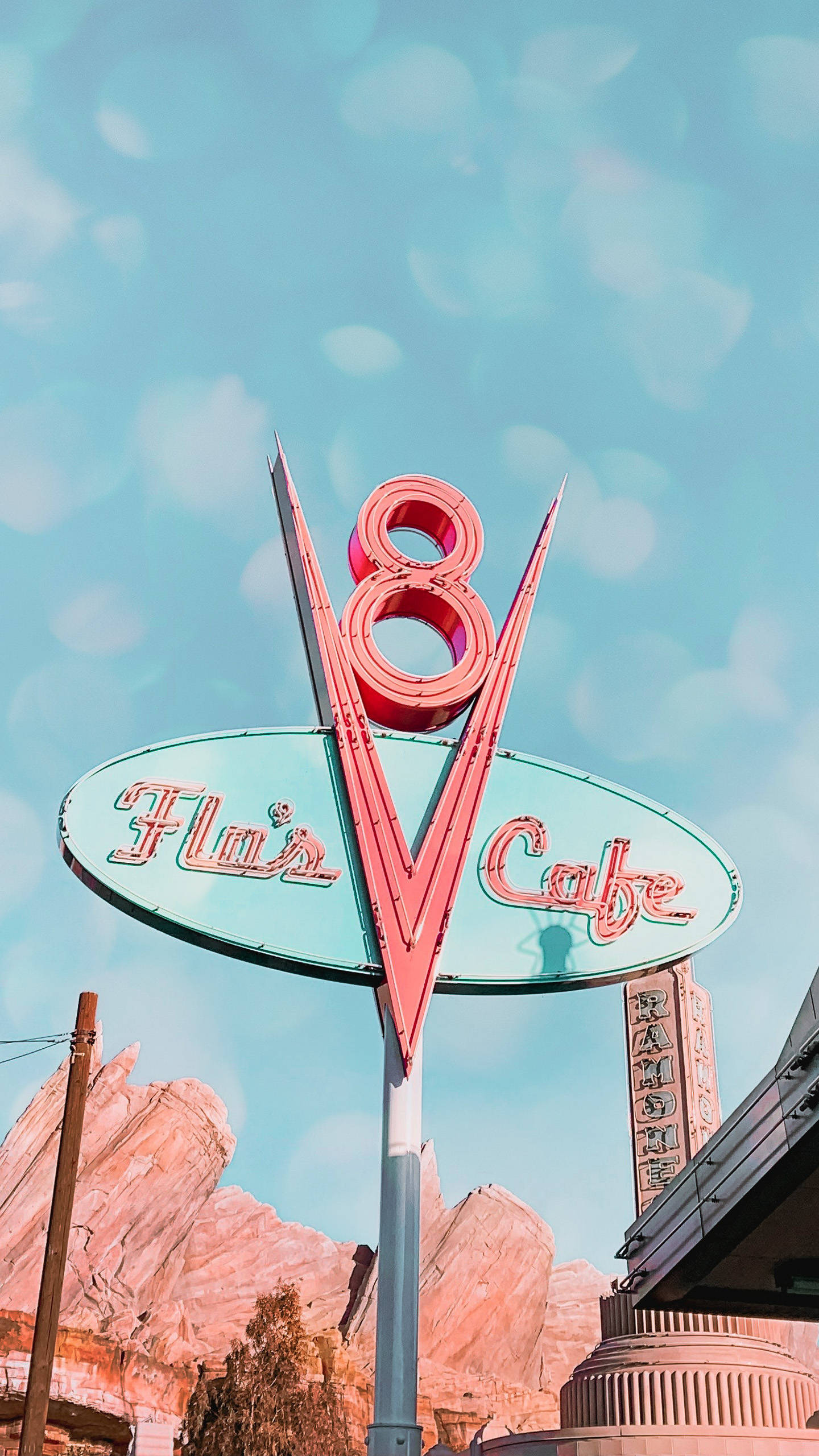 ディズニーランドで輝くフローズV8カフェの看板 壁紙