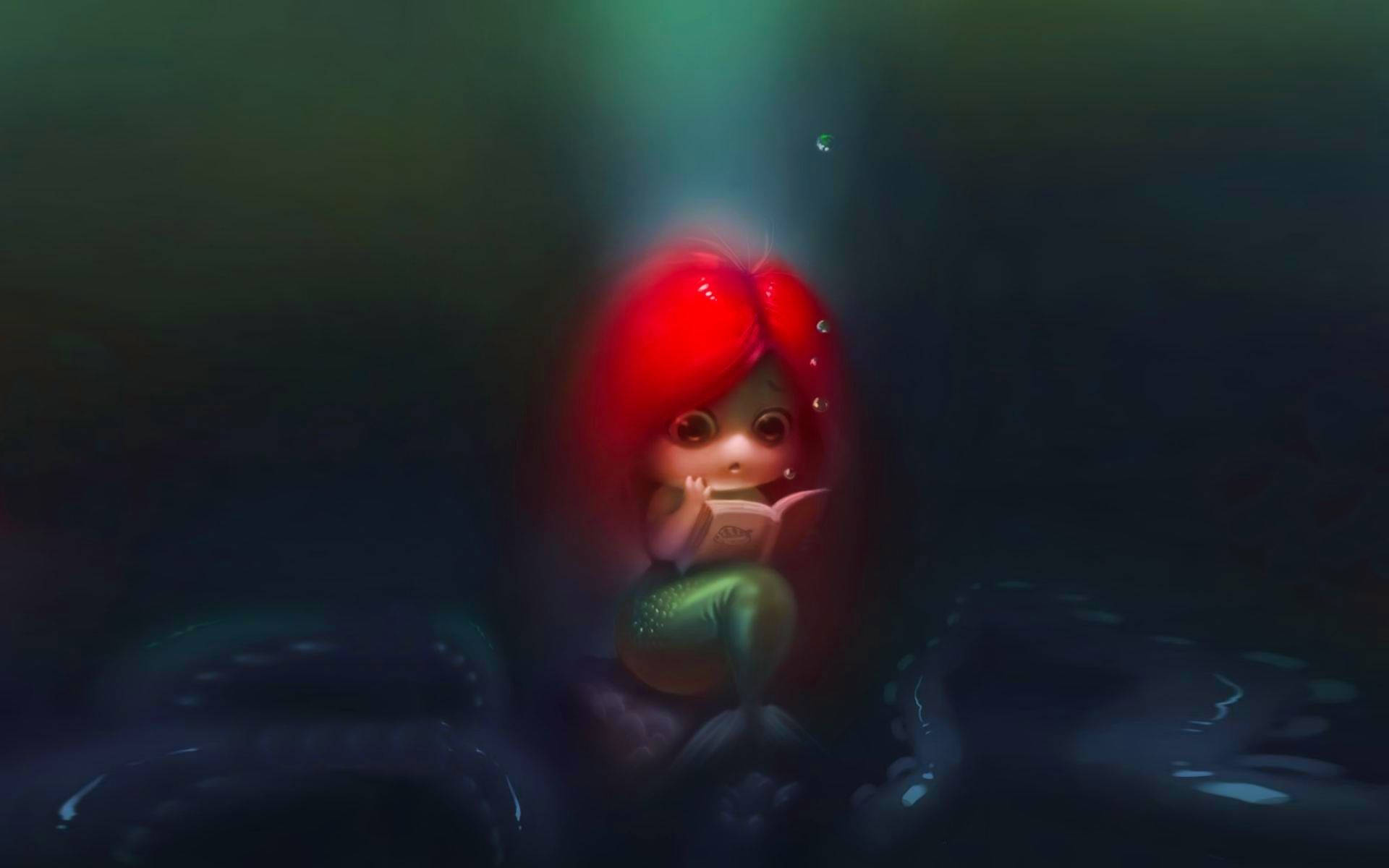 赤いふさふさの髪の本を読む人魚の女の子のデスクトップ壁紙