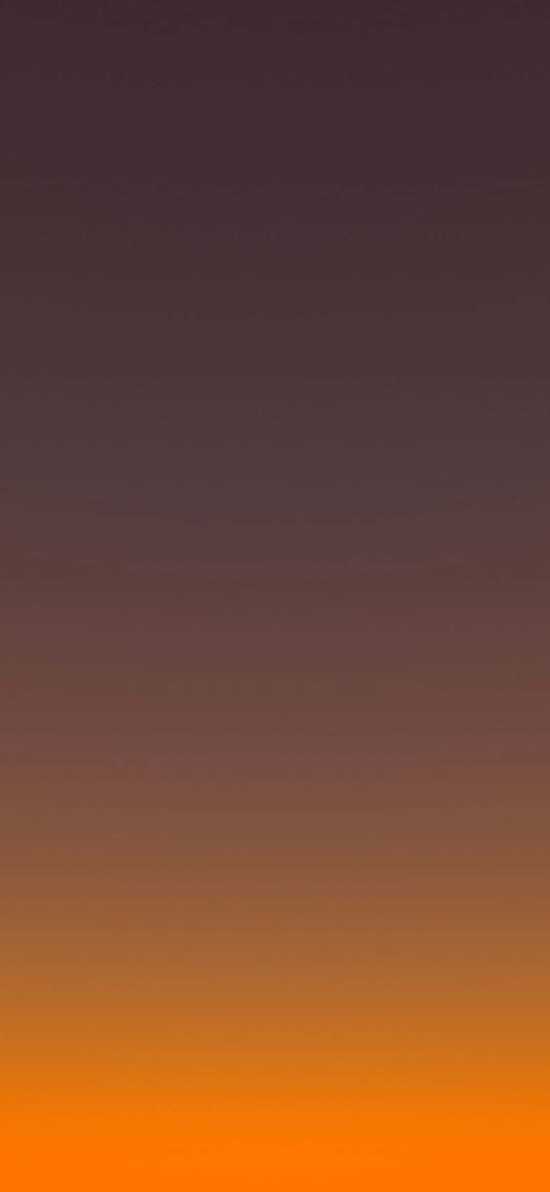 オレンジと黄色の夕日と背景の山 壁紙