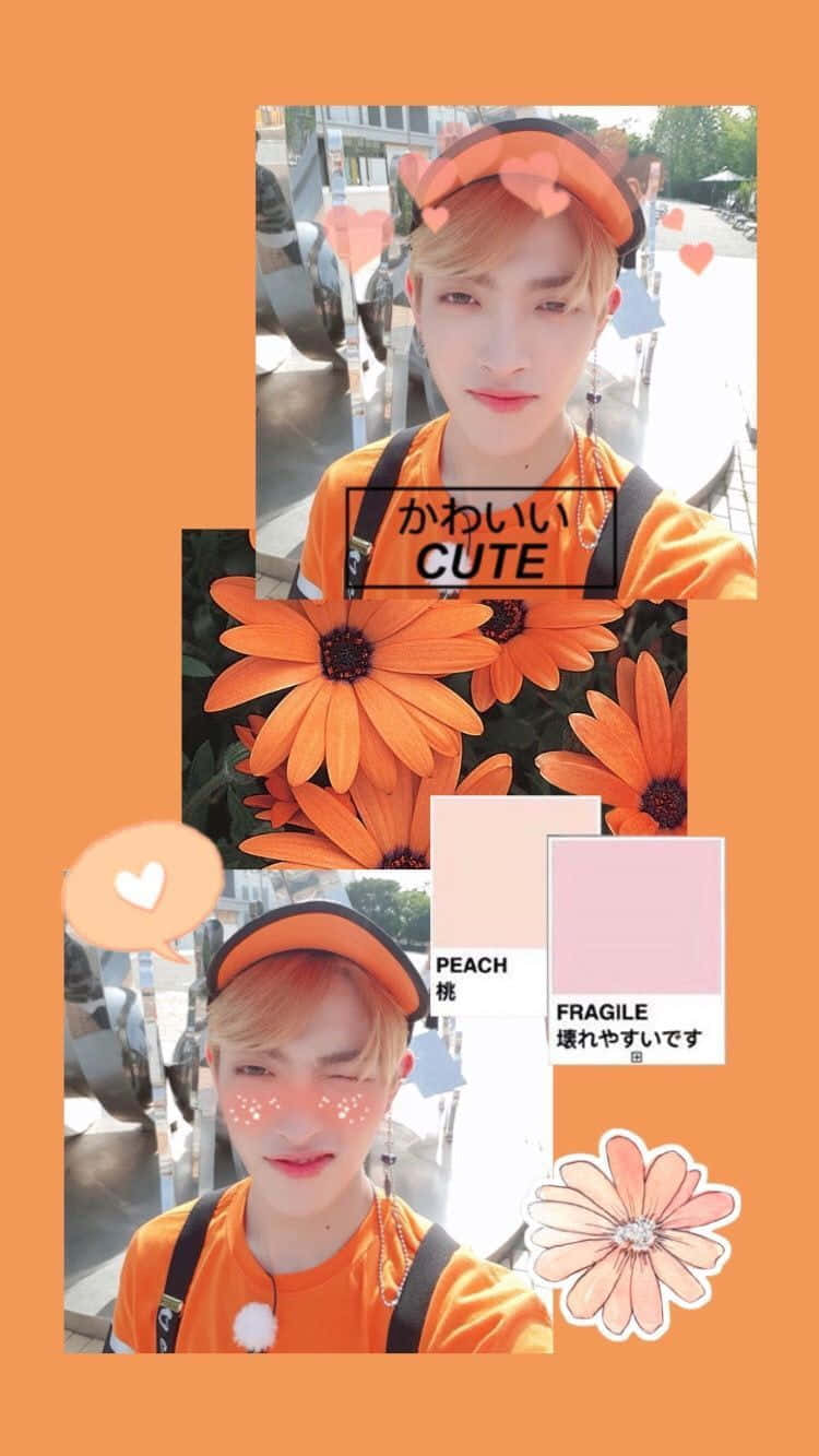 オレンジのシャツを着た男性と花の写真 壁紙