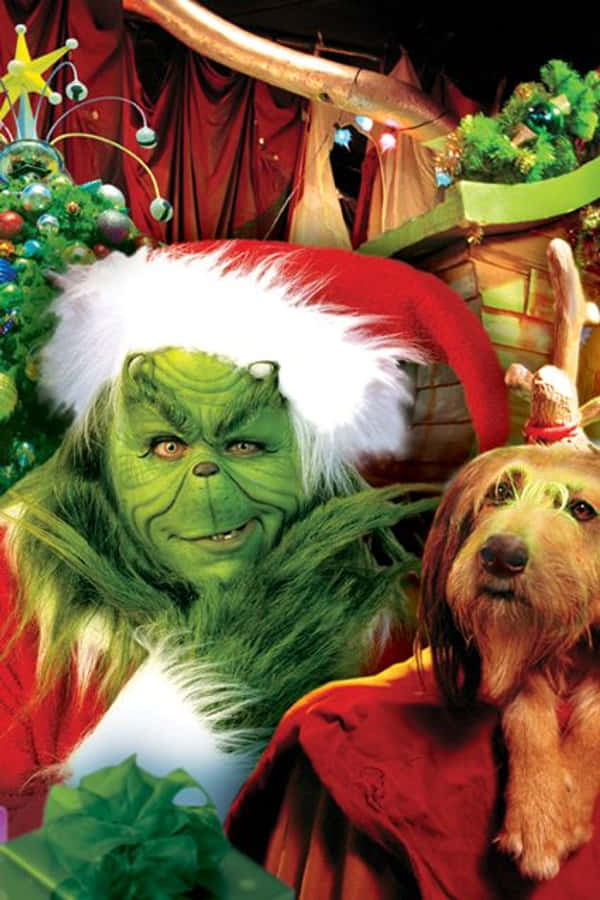 クリスマスのグリンチと犬 iPhone 壁紙