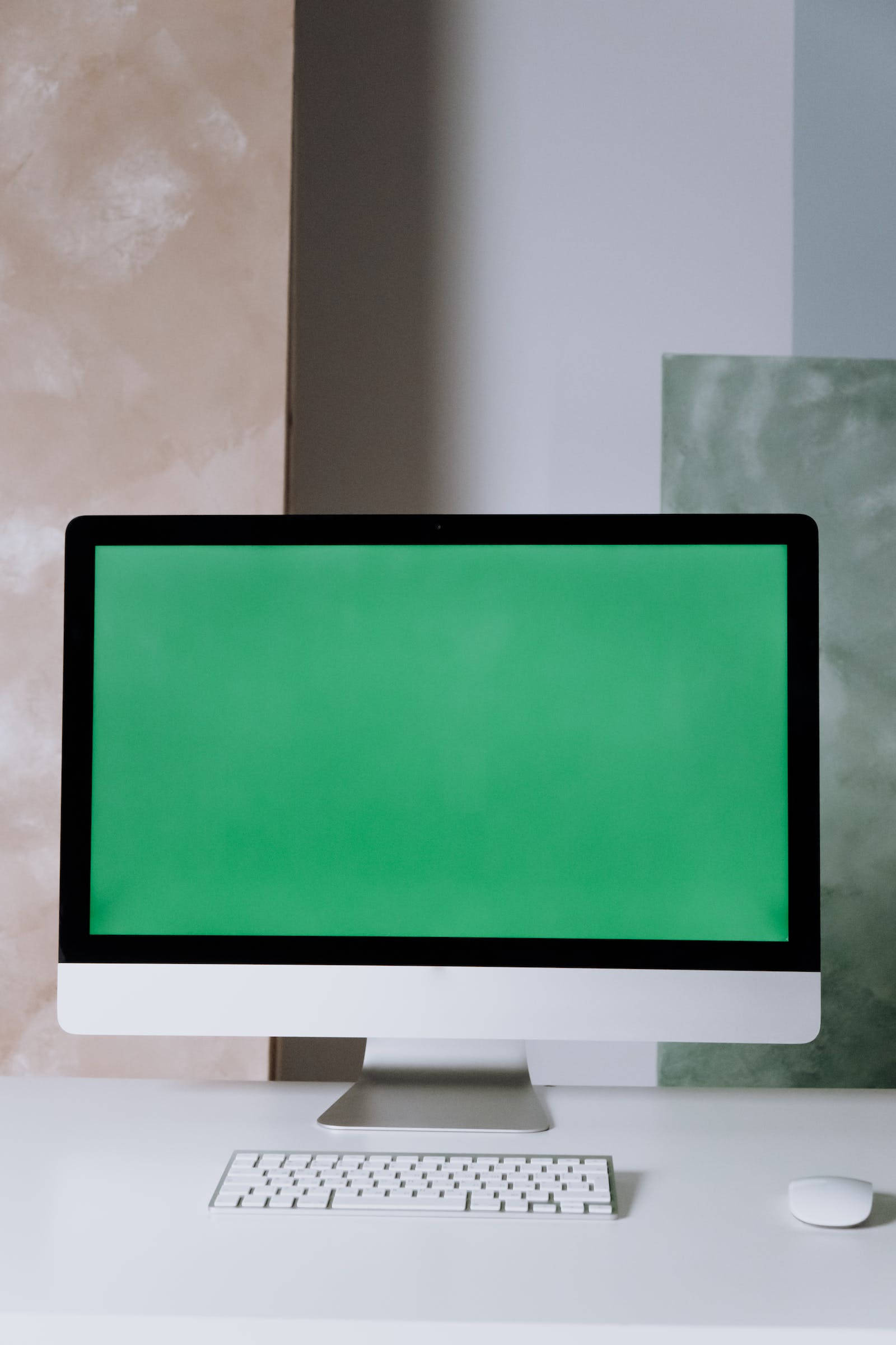 グリーンスクリーンのApple PCモニター 壁紙