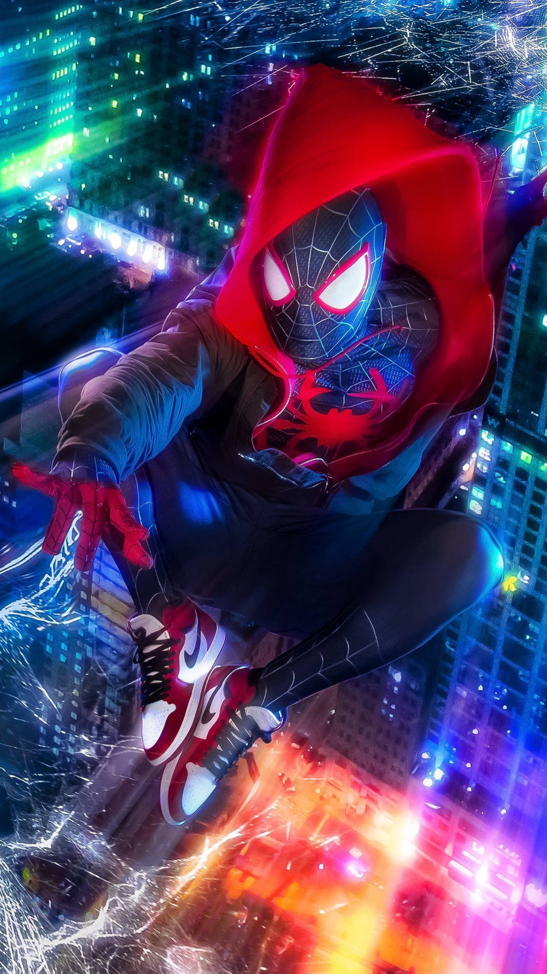 高層ビルの上で青く輝くスパイダーマン、カラフルな光の飛沫が周囲に広がる