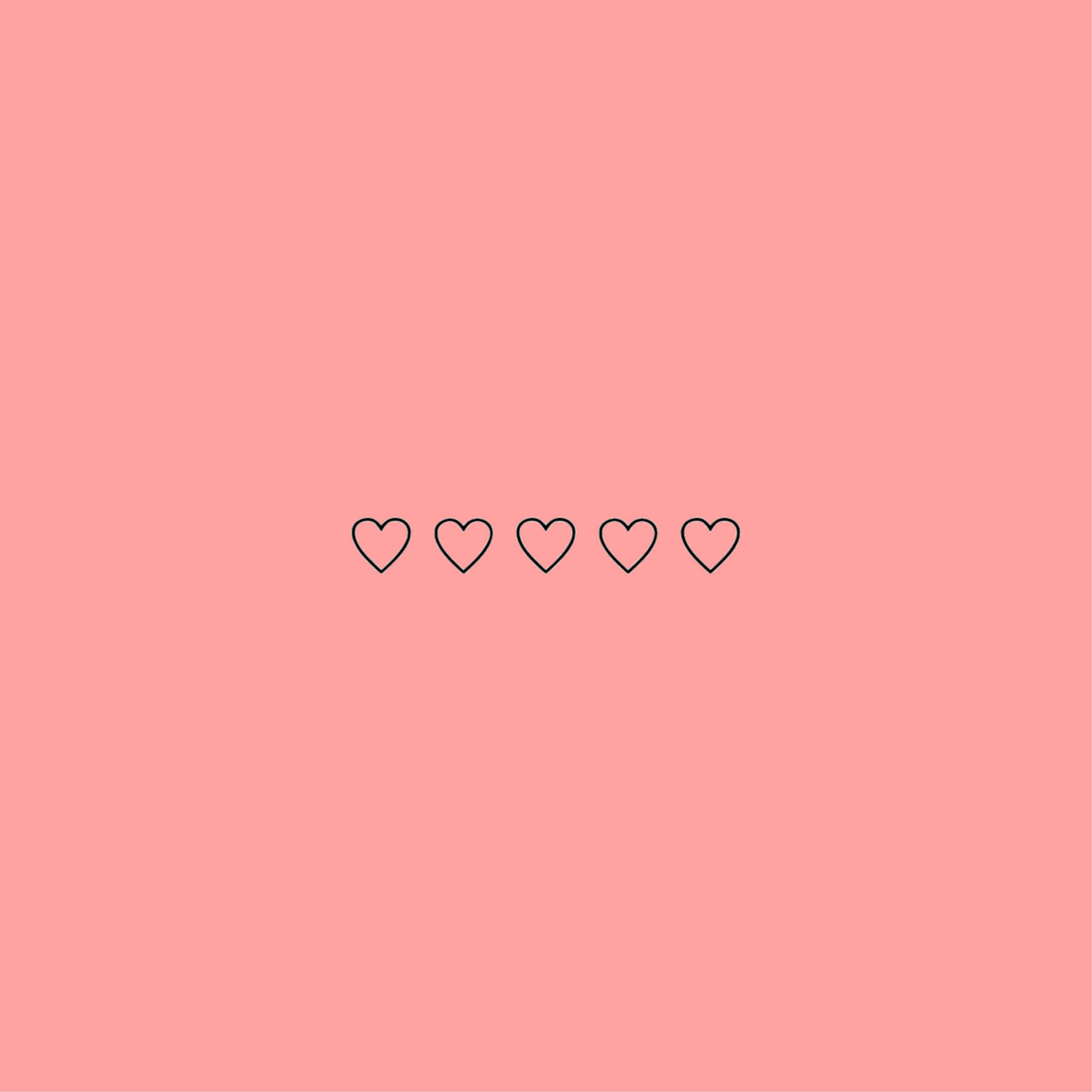 ハートの描かれたピンクの背景 壁紙