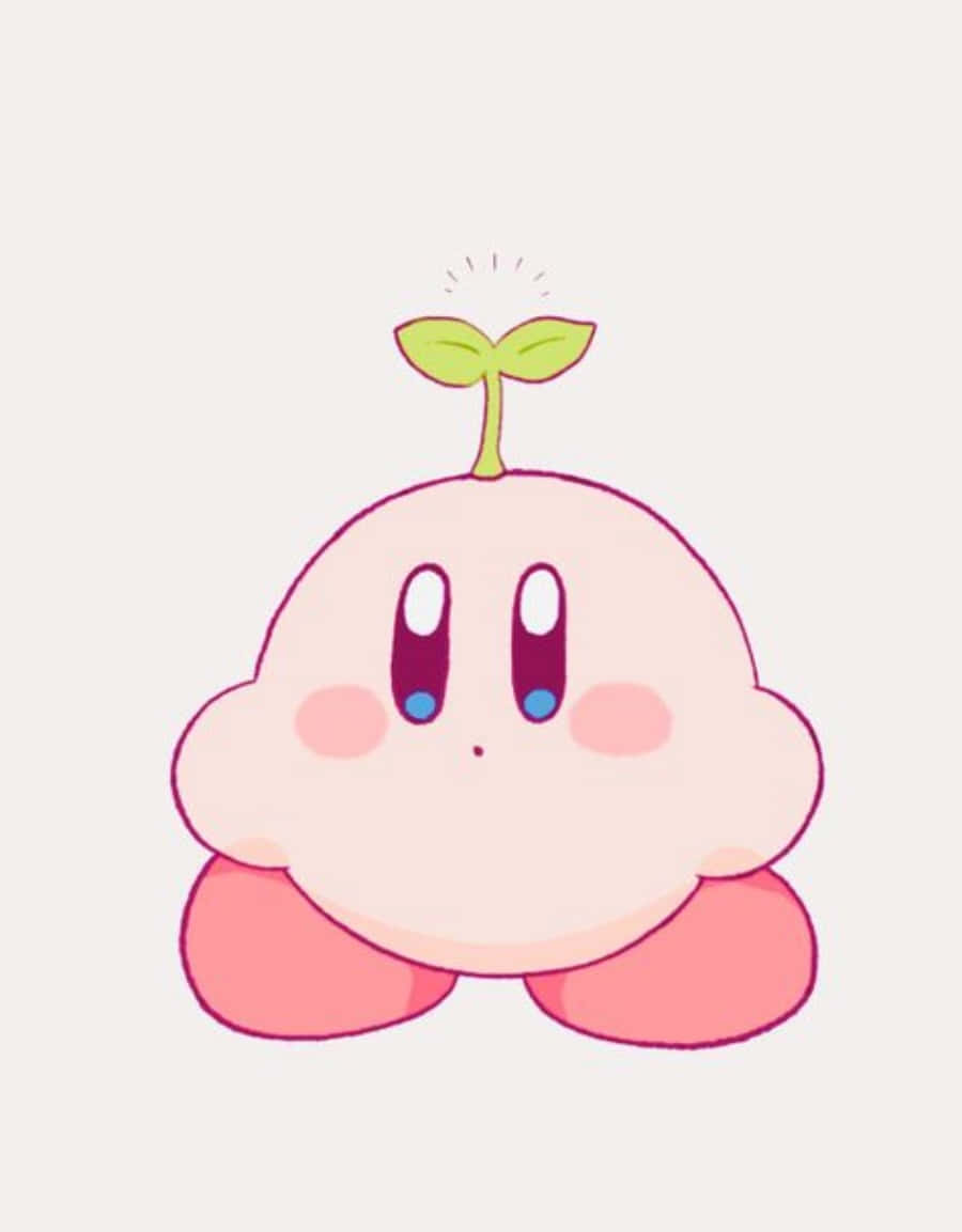 ピンクのカービィが頭に植物をのせている 壁紙