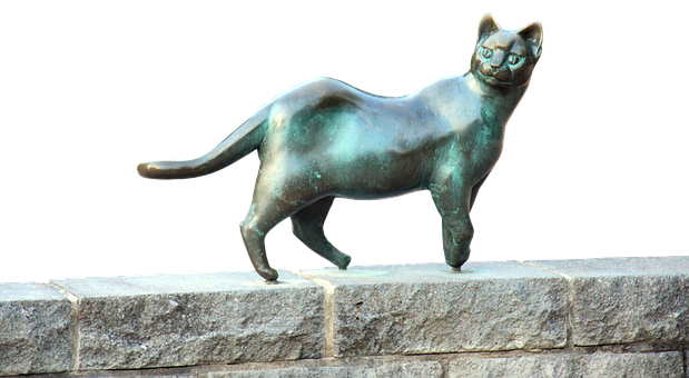 ブロンズの猫の彫刻と石の棚 壁紙