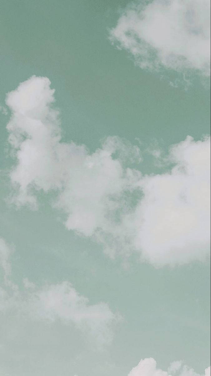 ミントグリーンのiPhoneに浮かぶ雲 壁紙