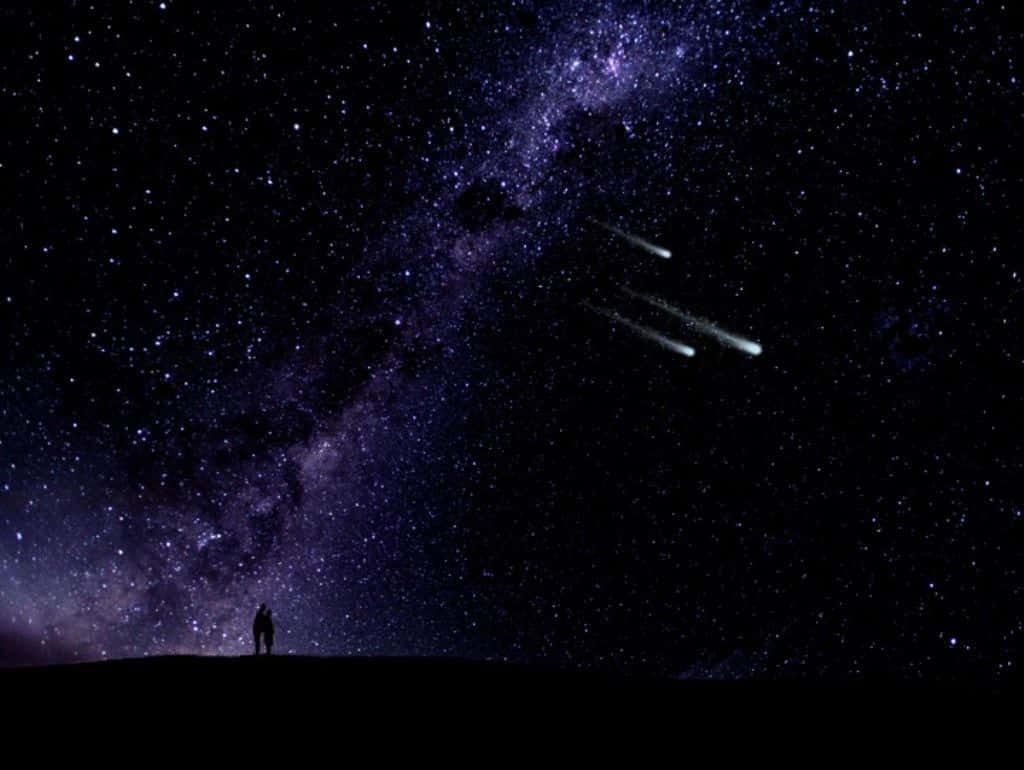 三つの輝く流れ星が描く魔法の夜空 壁紙