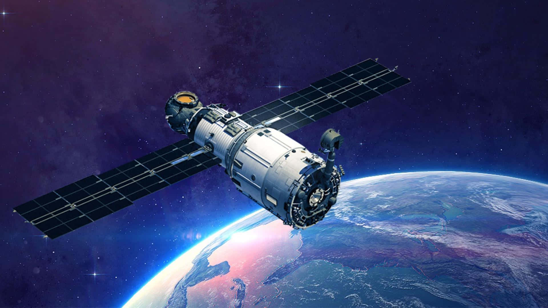 人工衛星が地球の上空を飛行している 壁紙