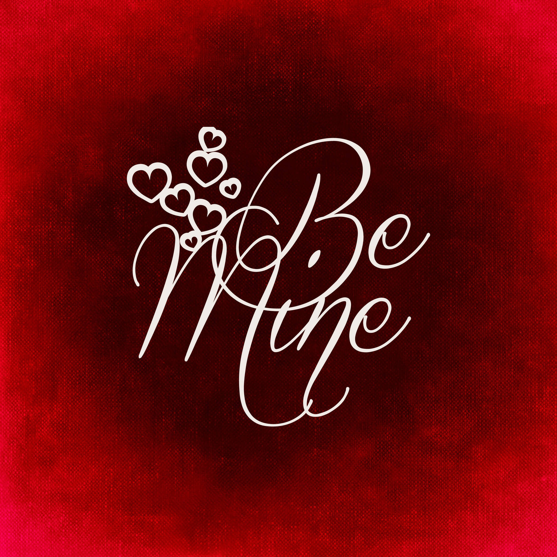 バレンタインデーに赤い背景に小さなかわいいハートと共に白く書かれた「Be mine」の愛のプロポーズ碑文