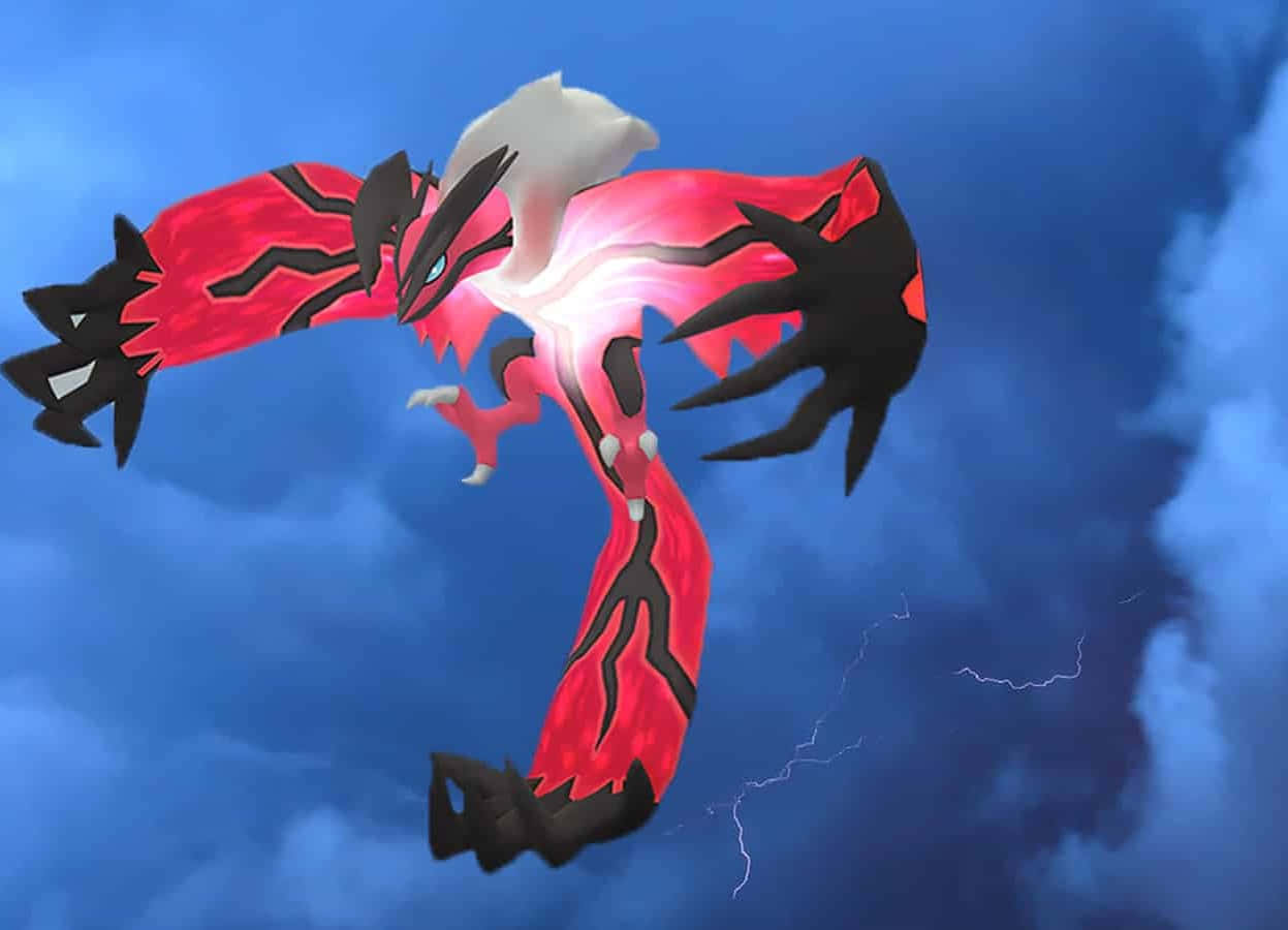 光るイベルタルが空を舞うポケモン 壁紙