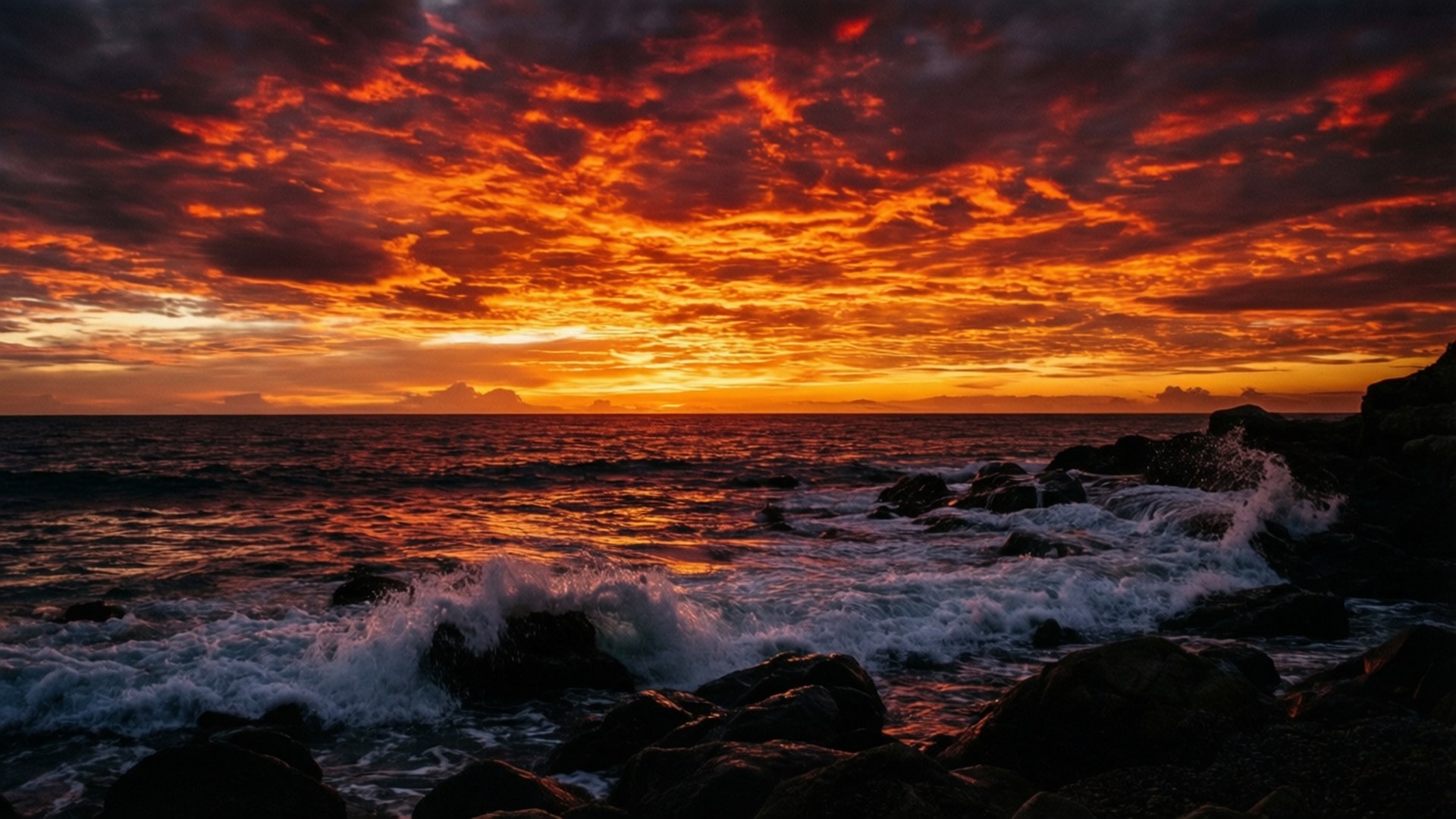 劇的な岩場の夕日 壁紙
