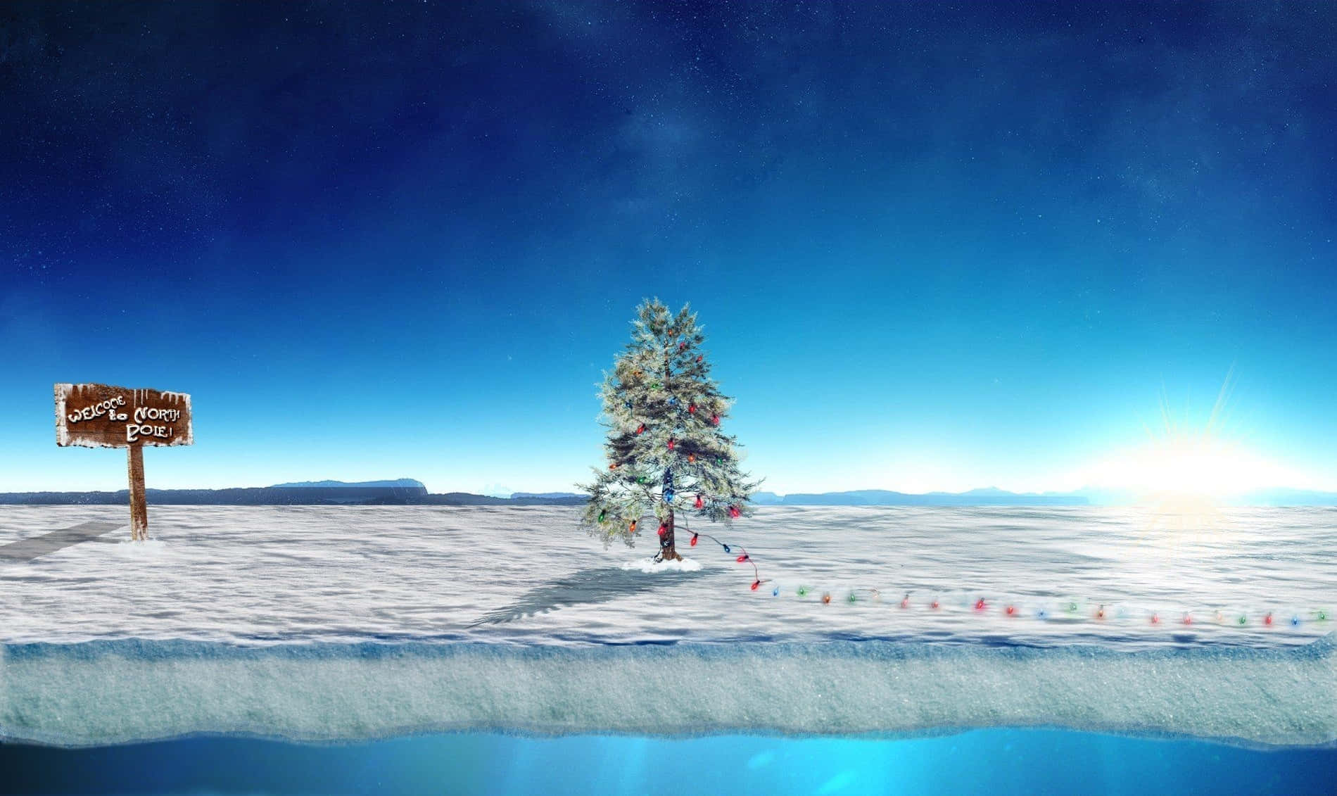 北極に立つ飾り付けられたクリスマスツリーの写真 壁紙
