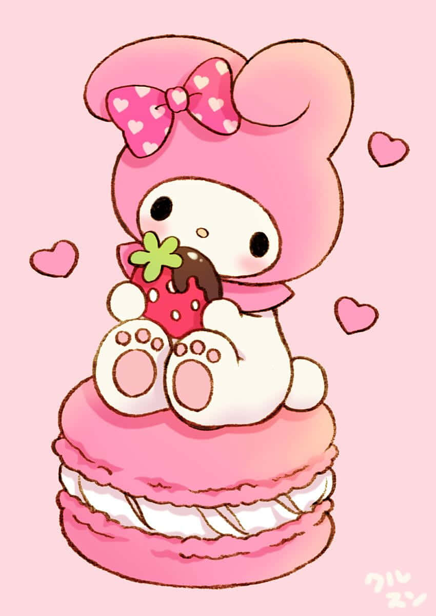 可愛いマイメロディがマカロンの上でイチゴを食べている