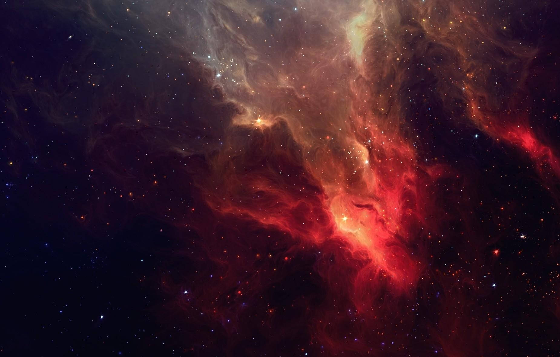 不規則な赤い銀河星雲と星々の素晴らしい壁紙。