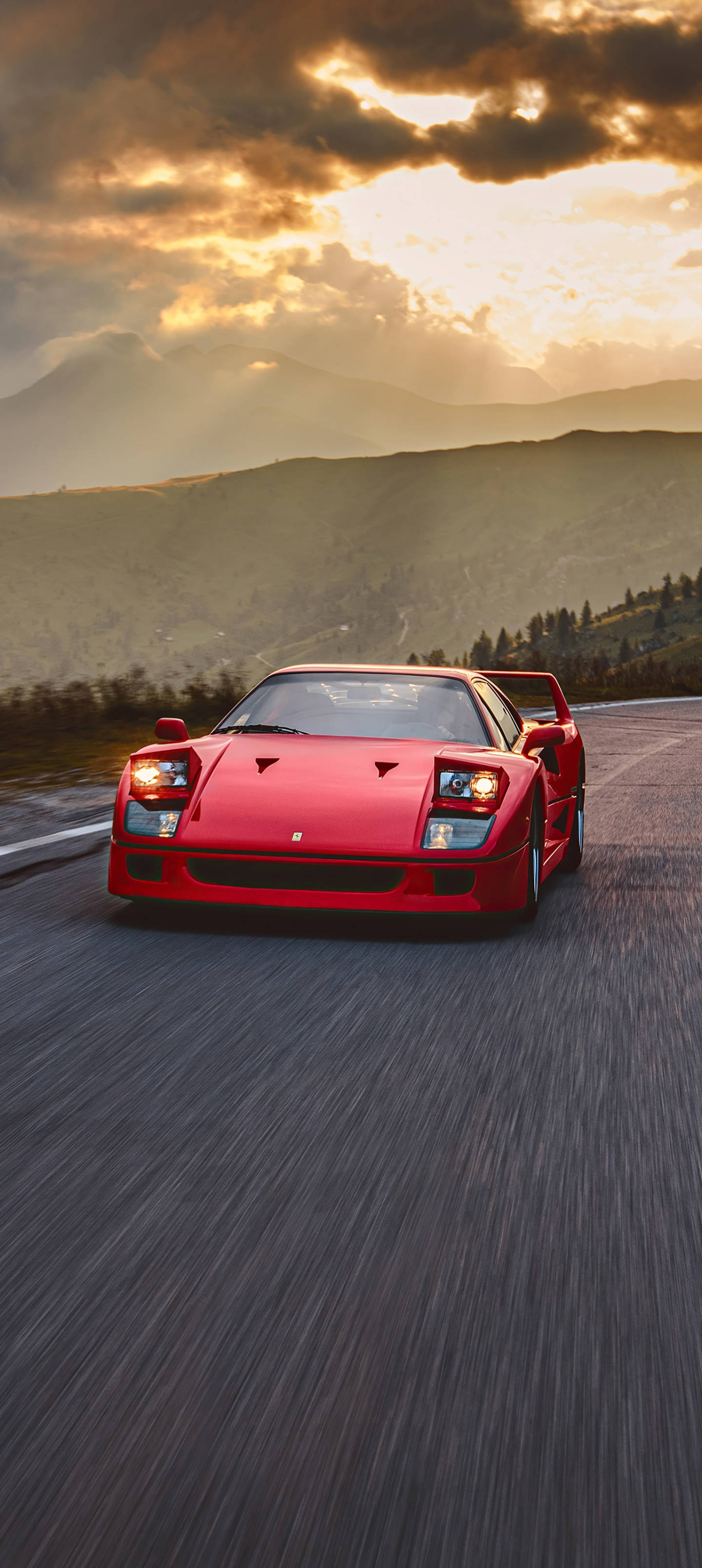 夕焼けの中のF40フェラーリの電話 壁紙