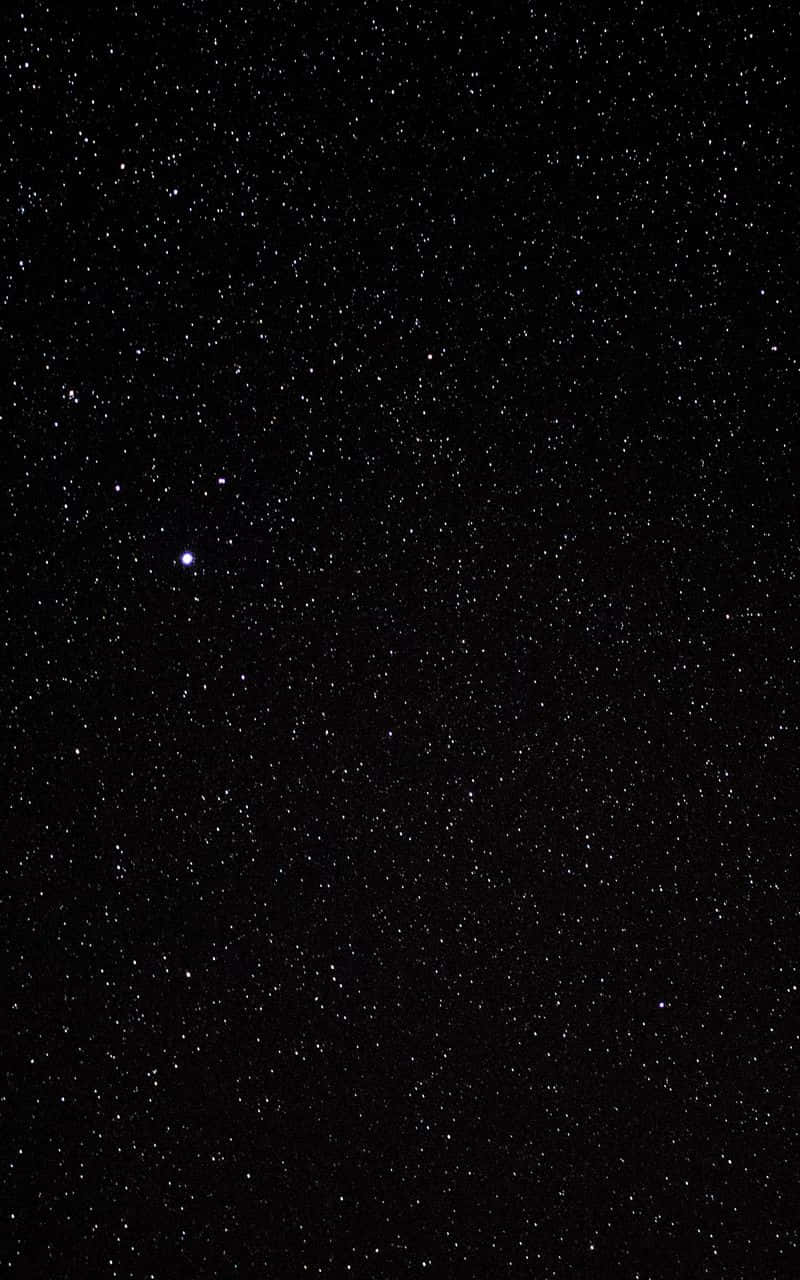 小さな星々が散りばめられたブラックグリッターの背景 壁紙
