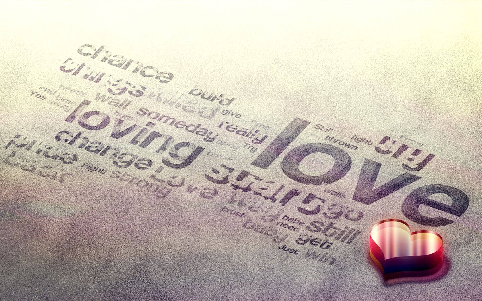 「loving」などの様々な愛の言葉が灰色の表面に書かれ、横に光る赤い3Dハートがある画像。