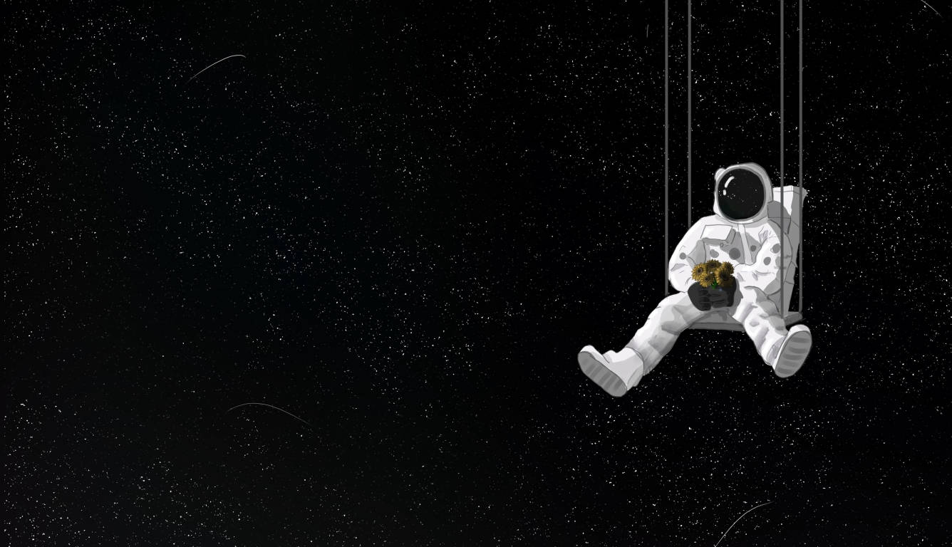 暗いノートパソコンに浮かぶ宇宙飛行士