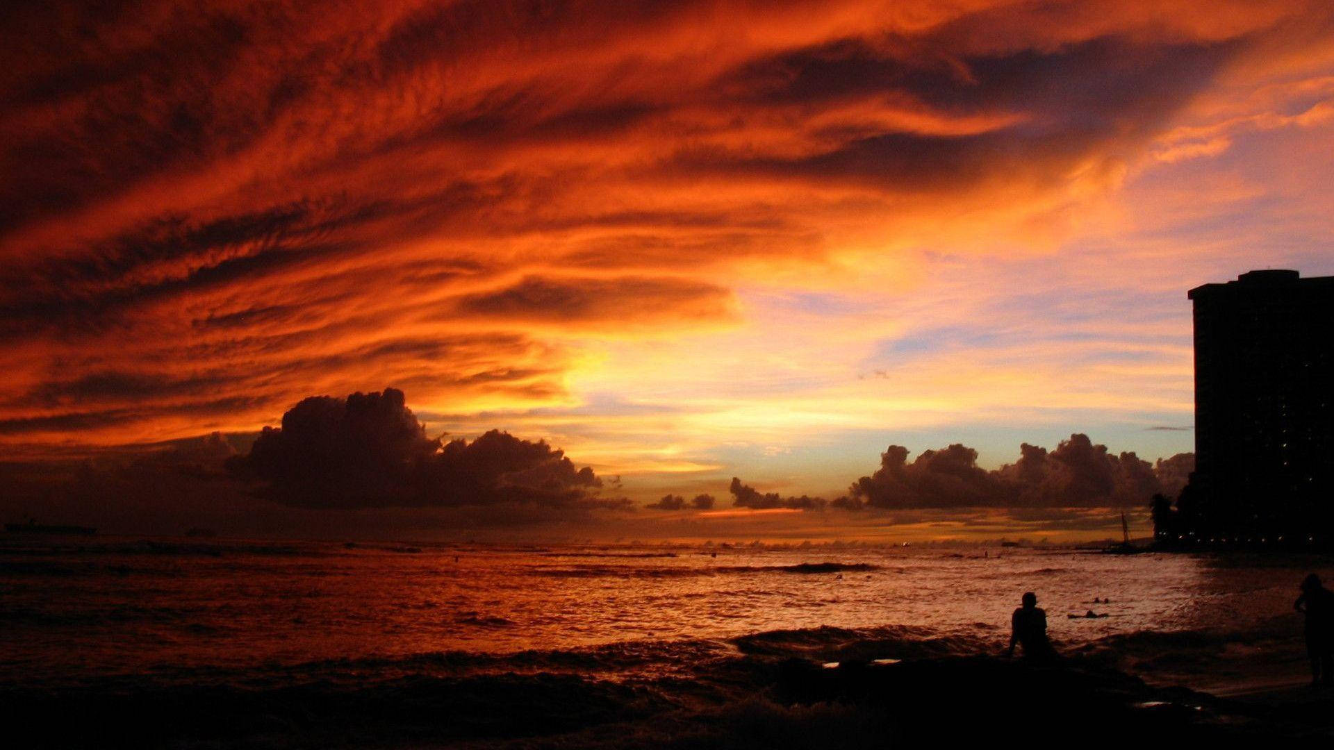 絶景の海の夕日と赤い雲 壁紙
