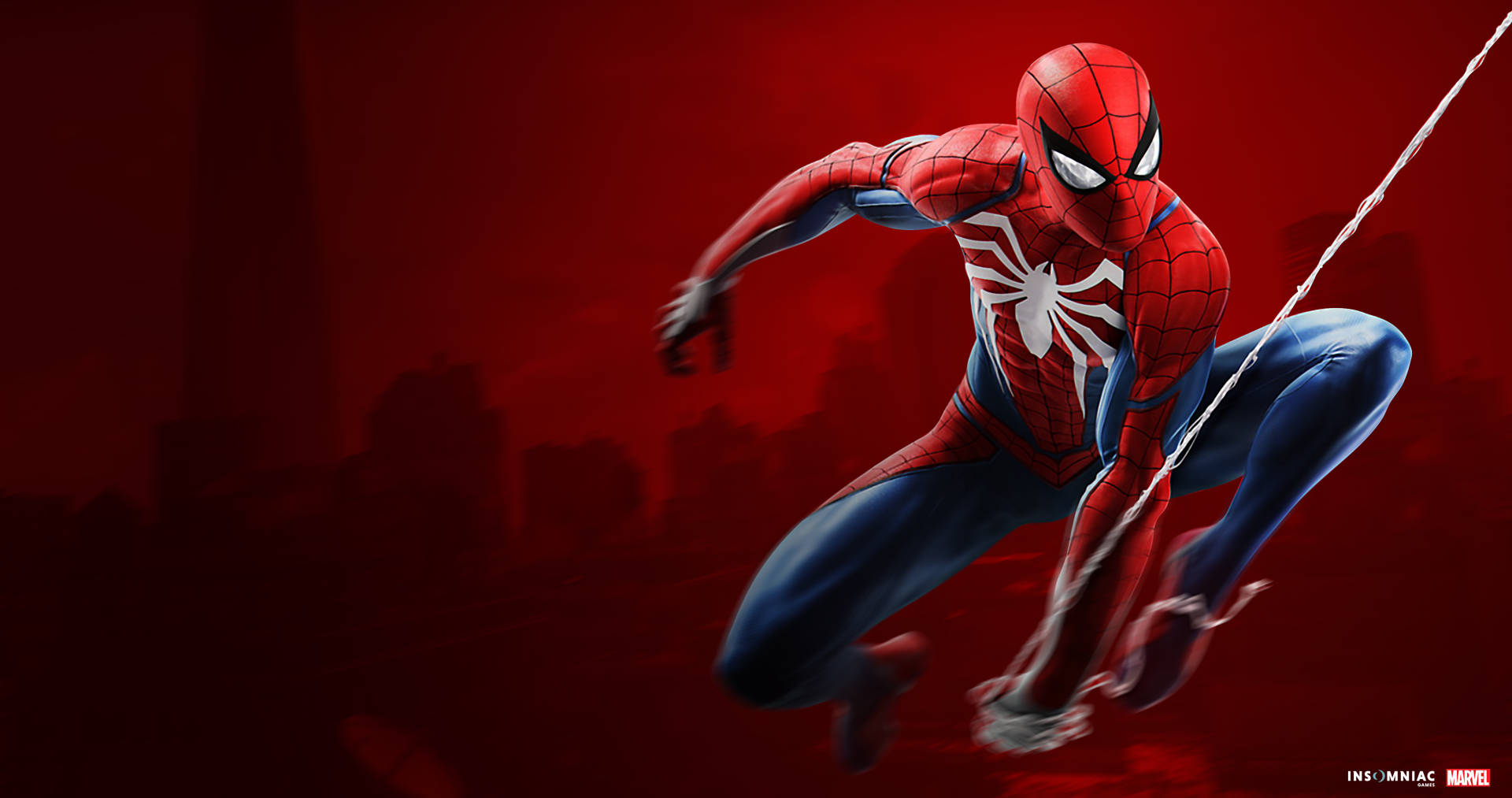 赤い背景の中でクモの巣にいるスパイダーマン