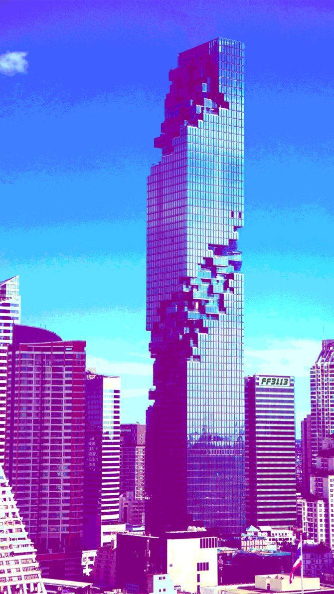 青空の下にそびえるモダンな高層ビルのクールな美的壁紙。