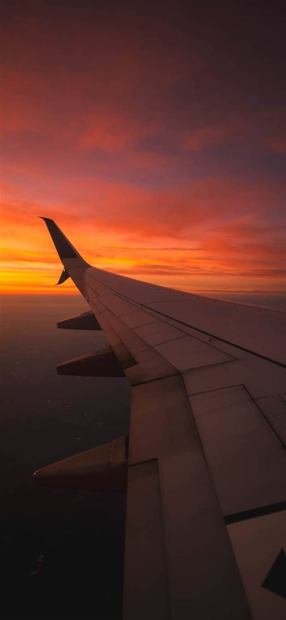 飛行機の翼と夕日のAndroid壁紙 壁紙