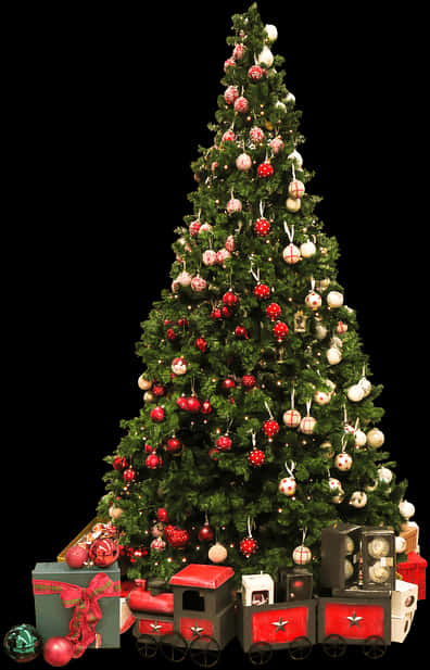 飾り付けられたクリスマスツリーと鉄道セット 壁紙