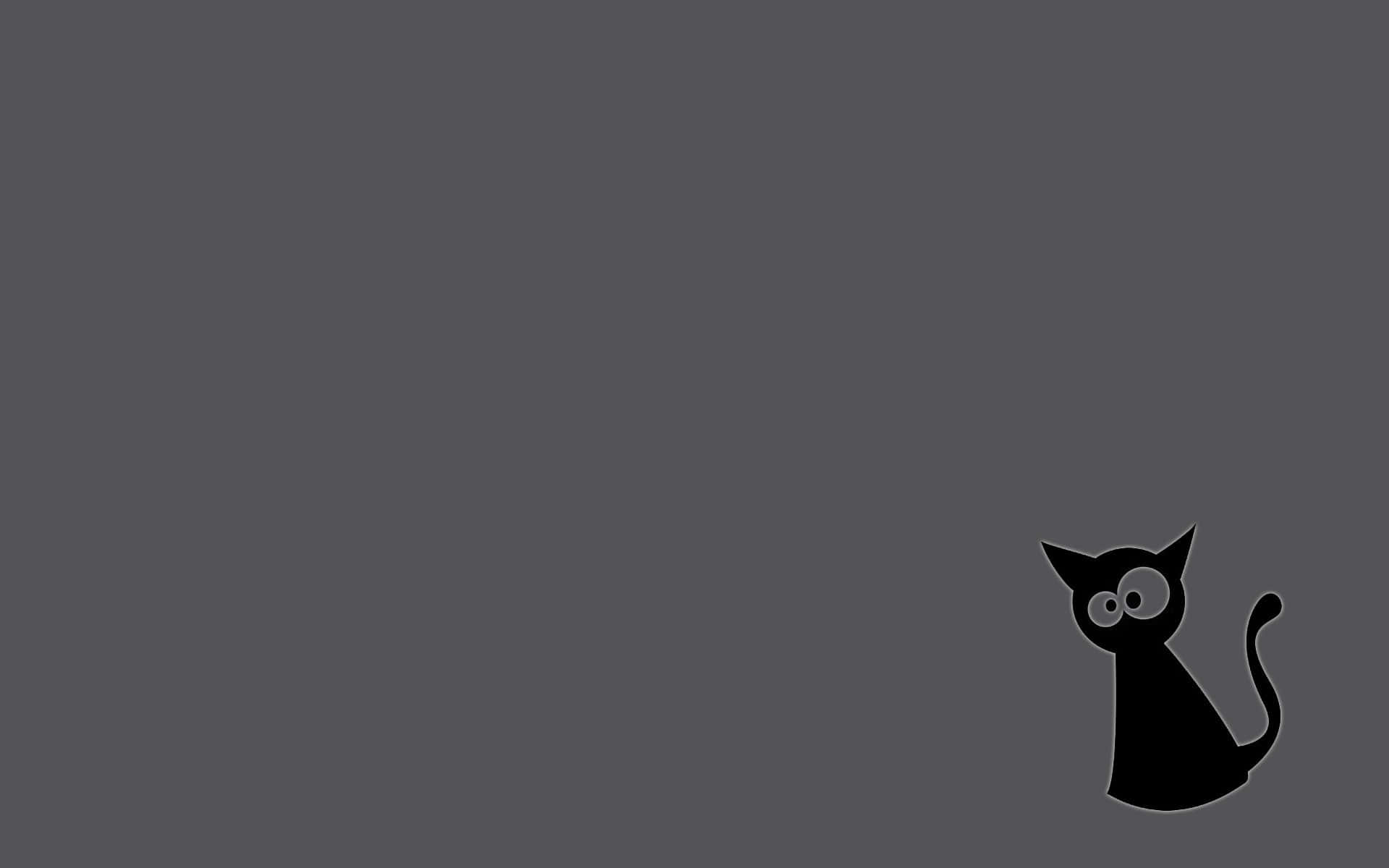 黒い猫がグレーの背景に座っている 壁紙