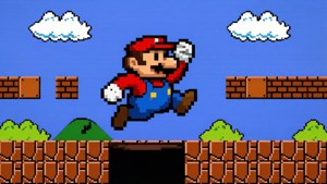 ピクセルアートで描かれたマリオが、クラシックな8ビットのスーパーマリオステージで穴を飛び越える、レトロで懐かしい壁紙。 — マリオ 壁紙