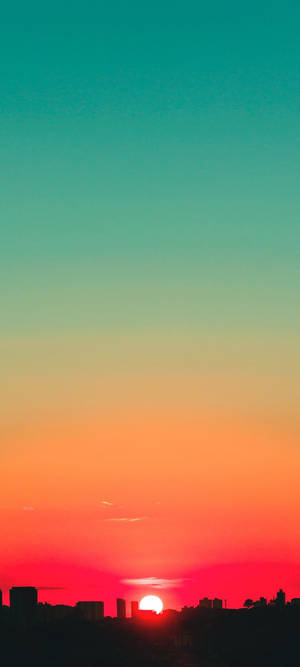 ティールと赤の夕焼け空の壁紙 — iPhone 16 Pro 壁紙