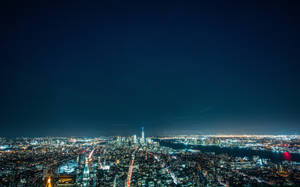 夜の明るい街明かりの壁紙