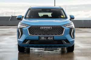 広大な風景を走る洗練された現代的なHaval SUV — MacBook Pro 壁紙